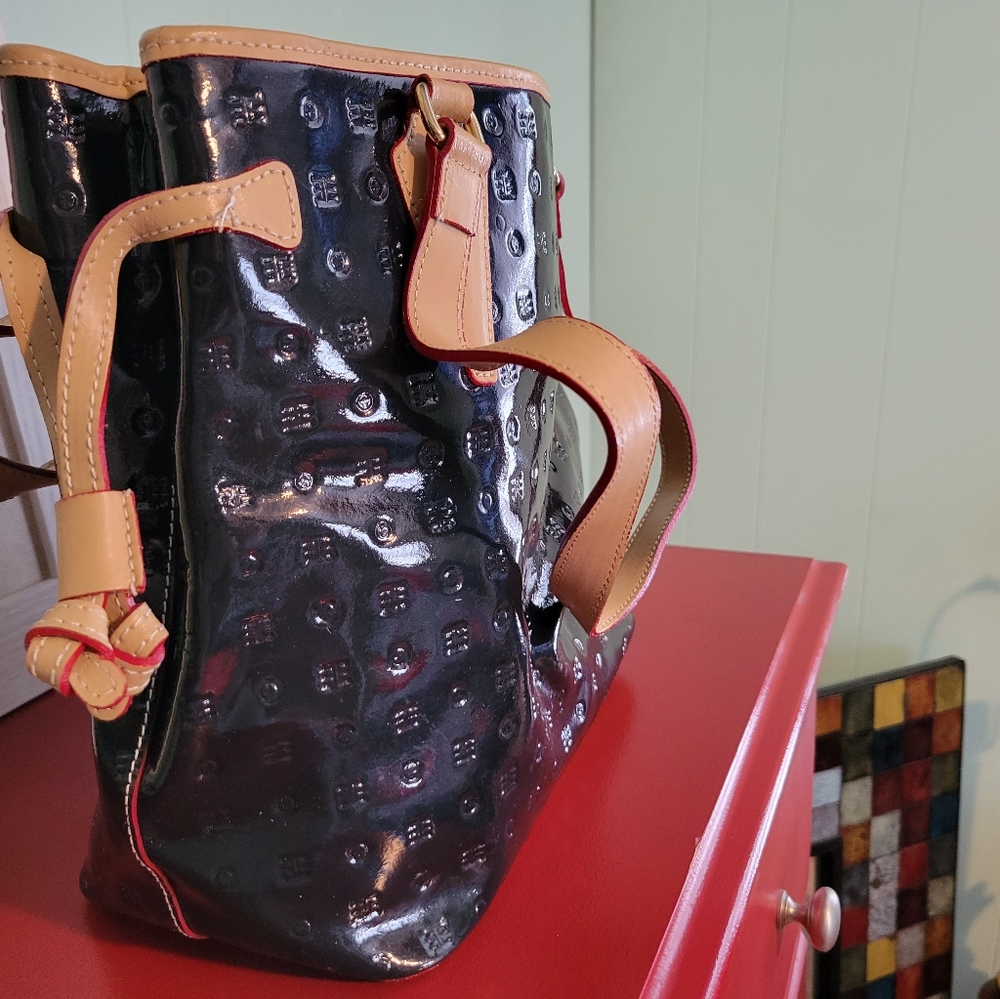 Arcadia designer hand bag. Navy with tan trim. Genuine patent leather.